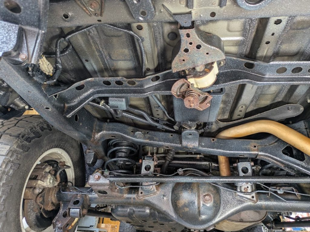 Vehicle underbody and suspension during undercoating