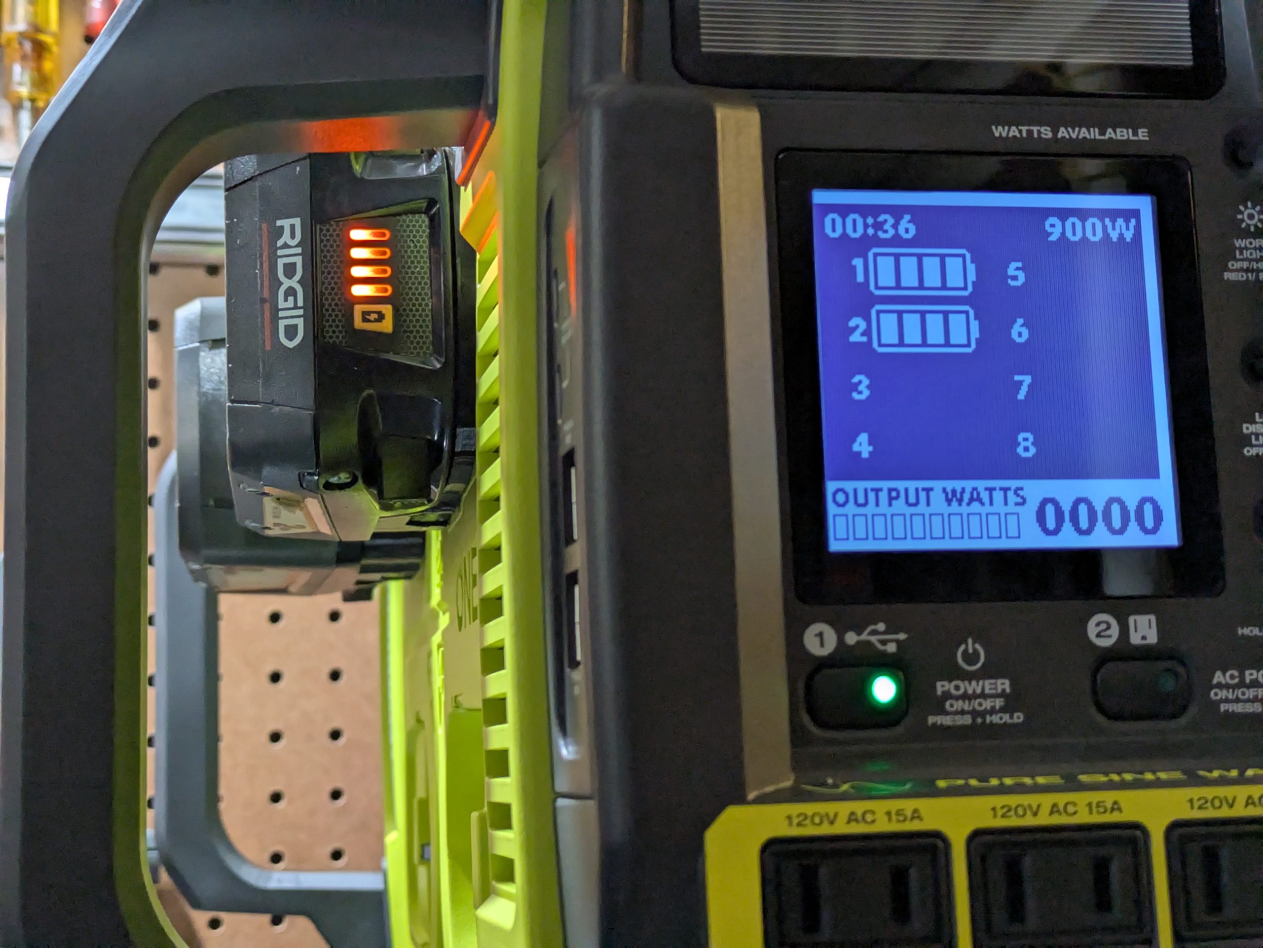 Ryobi power station display reading 900W available with two Ridgid batteries loaded through printed adapters