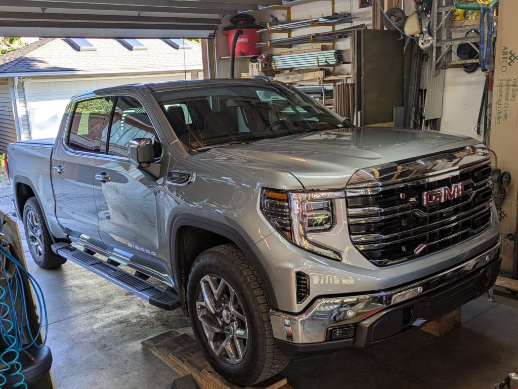 GMC Sierra pickup in the shop for undercoating