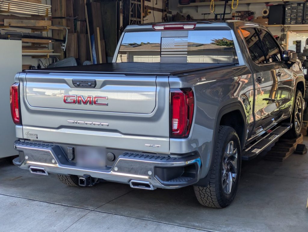 GMC Sierra pickup, rear view, in the shop for undercoating